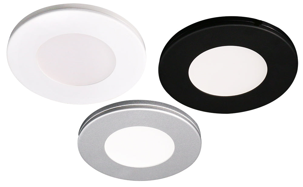 three lotus ad-107t led puck trims in white black and brushed nickel arranged in a row